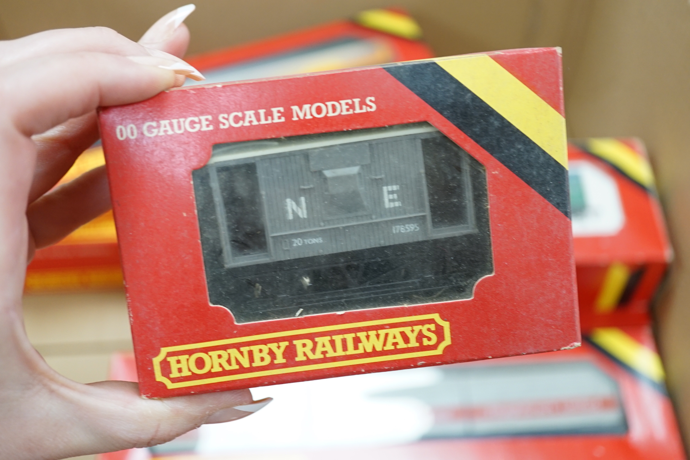 Thirty-six boxed Hornby railways 00 gauge items including five BR diesel locomotives; a Class 47 (R075), a Hymek (R074), a Class 25 (R068) and two Class 08 shunters (R156), together with fifteen freight wagons, twelve bo